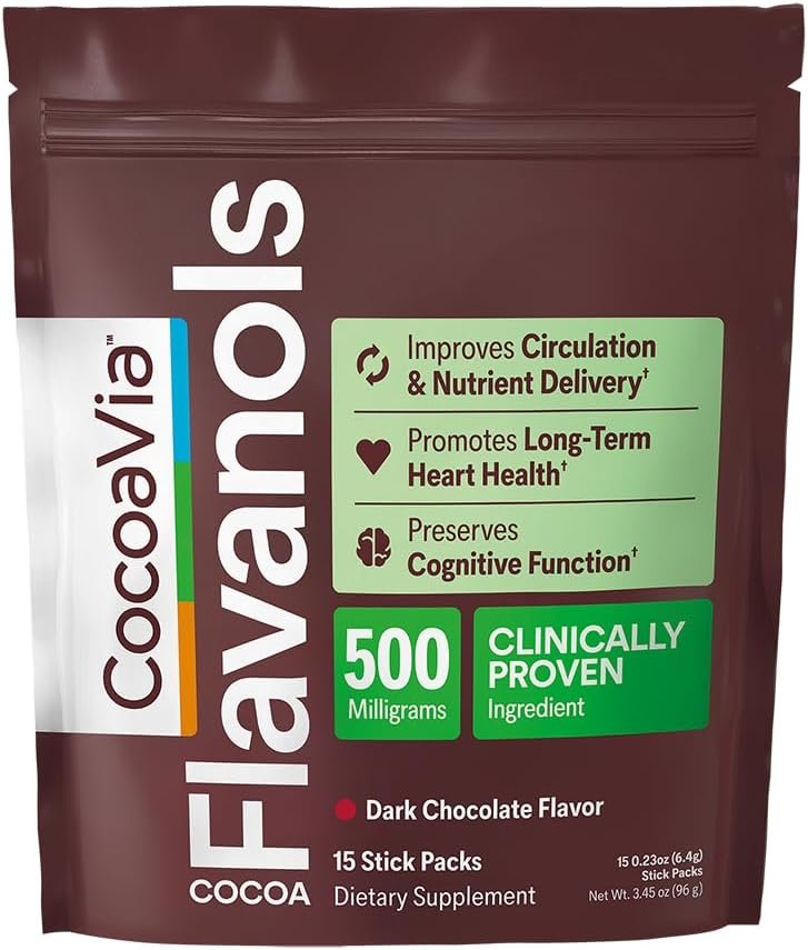CocoaVia flavanol stick packet positioned next to a steaming coffee mug on a bright kitchen counter