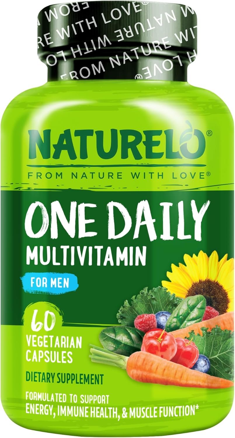 NATURELO multivitamin capsules spilling from bottle onto dark slate, macro close-up with shallow focus