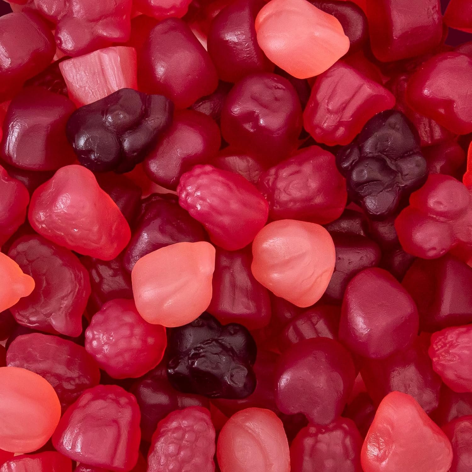 Berry jelly candy mix bag on a sunlit kitchen counter with fresh fruit and glass of water nearby