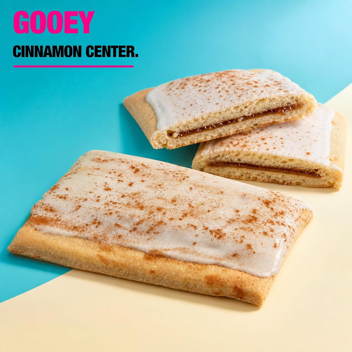 Frosted Cinnamon Protein Pastry on kitchen counter next to coffee and fitness journal in bright morning setting